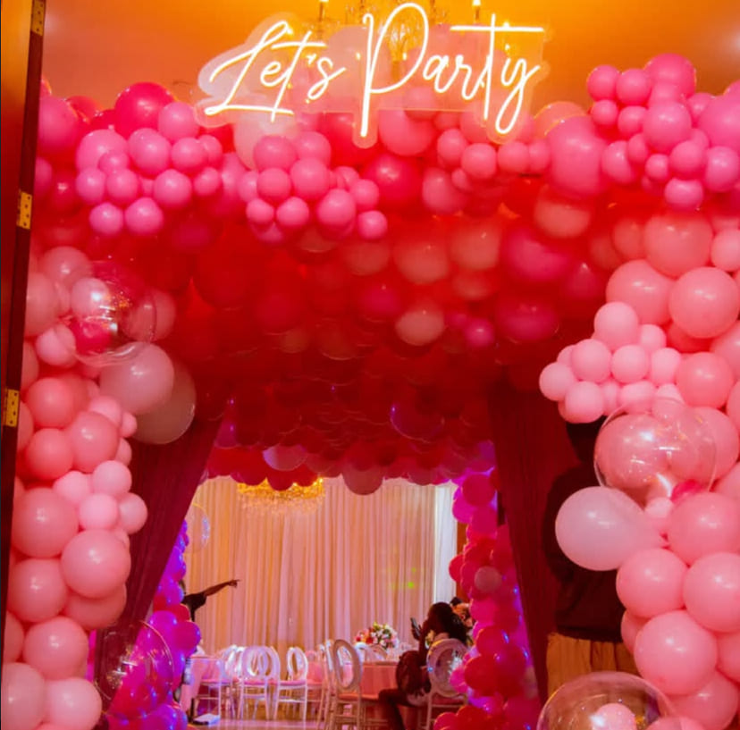 Warm wedding lighting with floral arch