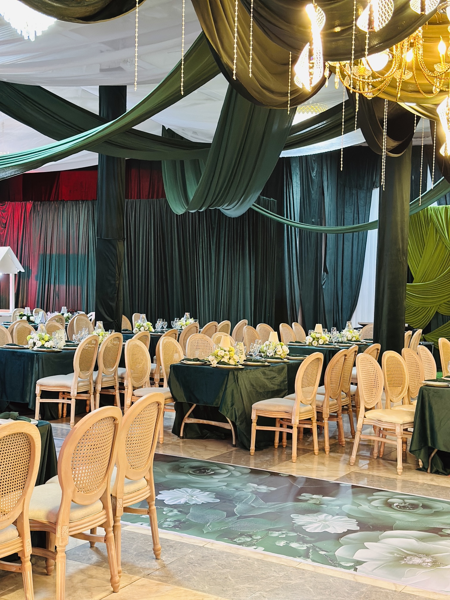 Lapelle Events venue transformation with emerald drapery
